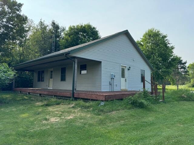 back of house with a yard