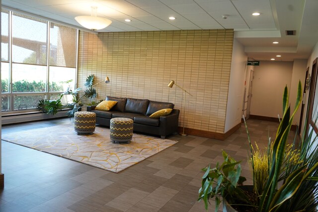 8900 E Jefferson Ave Unit 624, Detroit, MI 48214 - building lobby featuring recessed lighting and tile walls