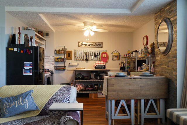 8900 E Jefferson Ave Unit 624, Detroit, MI 48214 - dining room featuring a ceiling fan, a textured ceiling, and wood finished floors