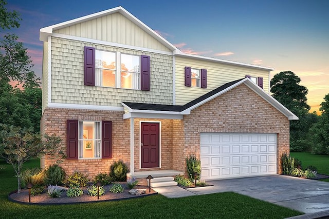 front of property featuring a garage and a yard