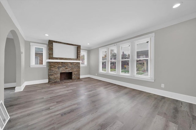 unfurnished living room with a fireplace and hardwood / wood-style flooring