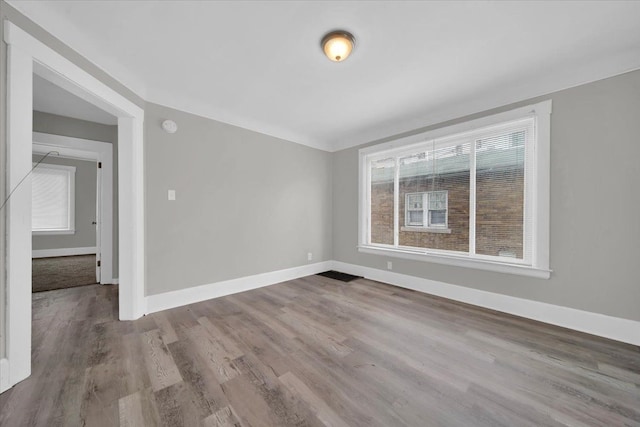 spare room with light hardwood / wood-style floors