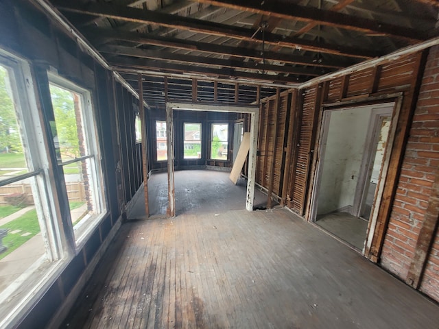 misc room with dark hardwood / wood-style floors, a wealth of natural light, and french doors