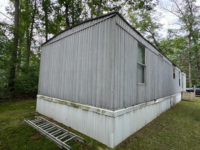 view of home's exterior featuring a lawn