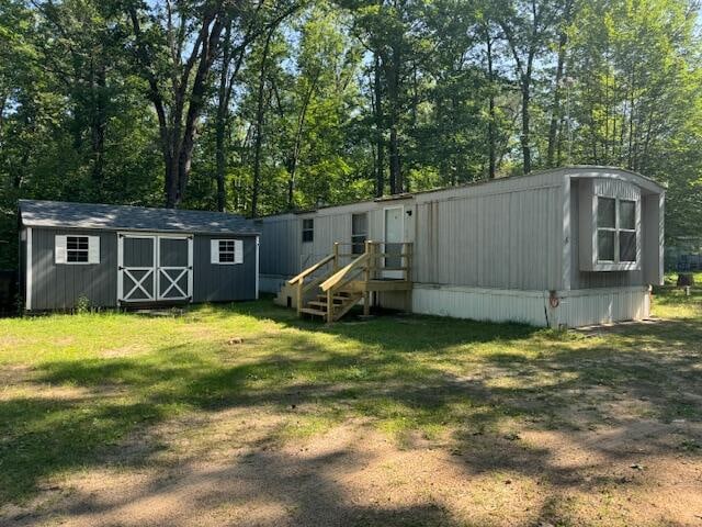 back of property featuring a lawn