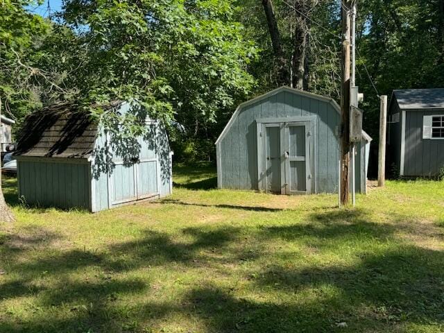 view of outdoor structure with a lawn