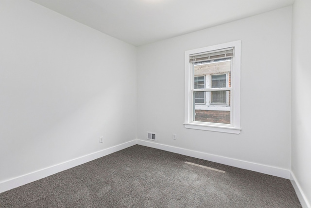 empty room featuring carpet flooring