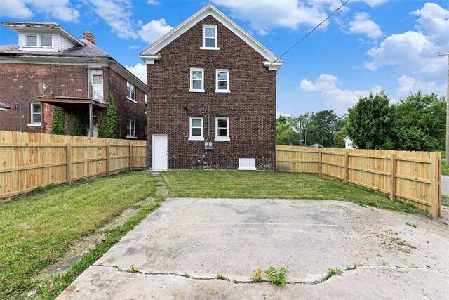 392 Philip St, Detroit, MI 48215 - back of house featuring brick siding and a patio