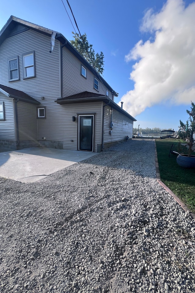 rear view of property with a patio area