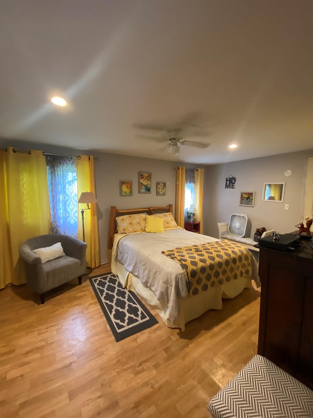 bedroom featuring ceiling fan and light wood-type flooring