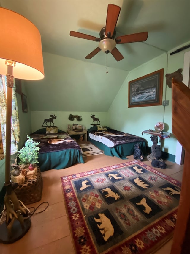 tiled bedroom with vaulted ceiling and ceiling fan