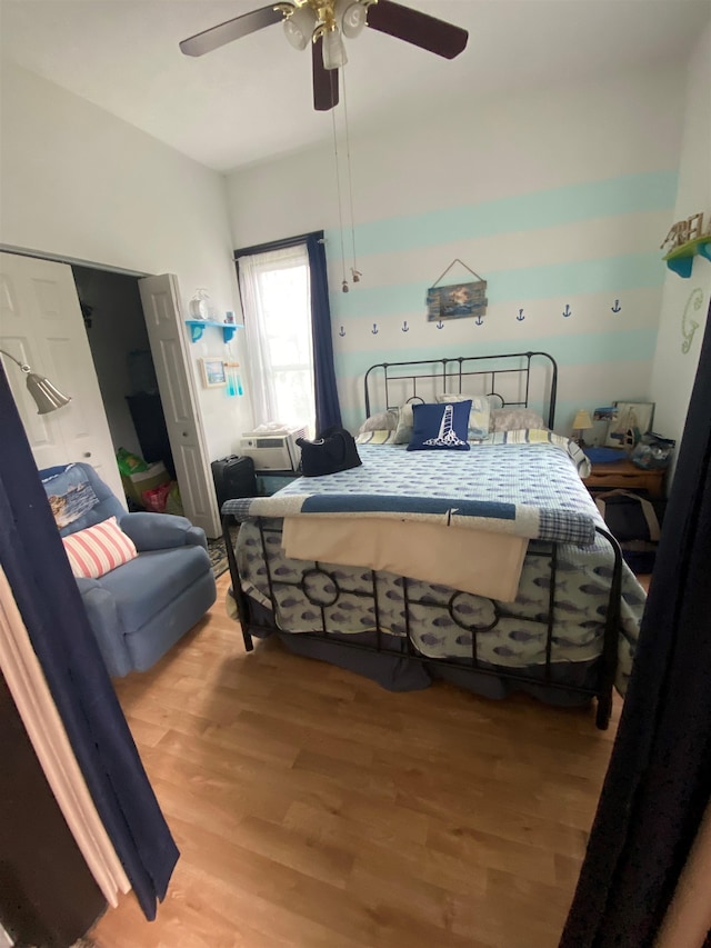 bedroom with wood-type flooring and ceiling fan