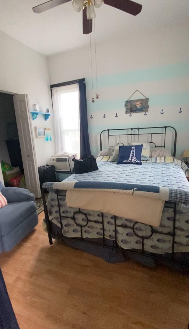 bedroom featuring ceiling fan and light hardwood / wood-style floors