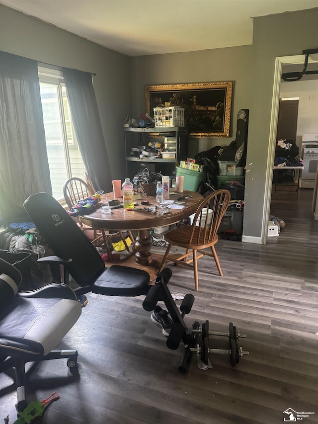 dining space with hardwood / wood-style floors