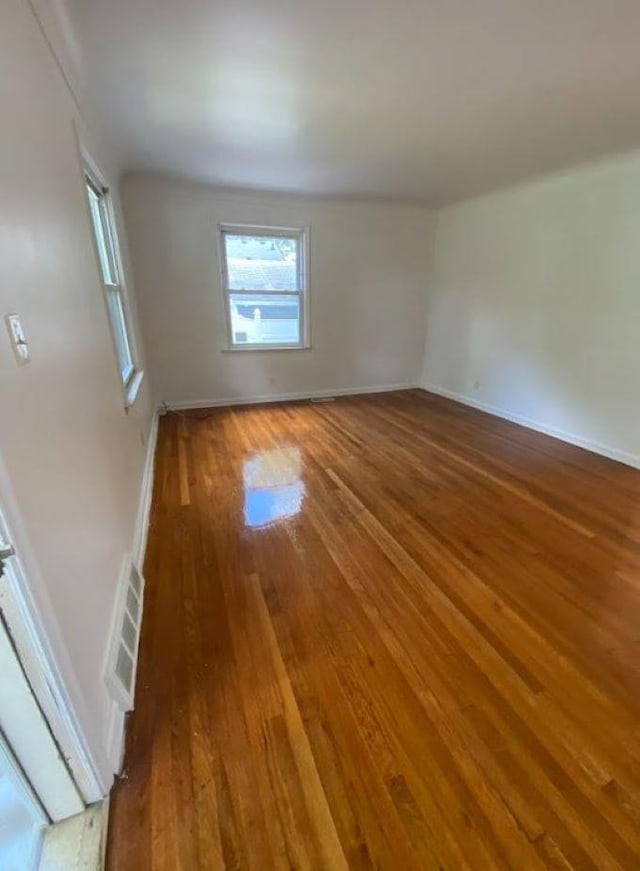 empty room featuring hardwood / wood-style floors