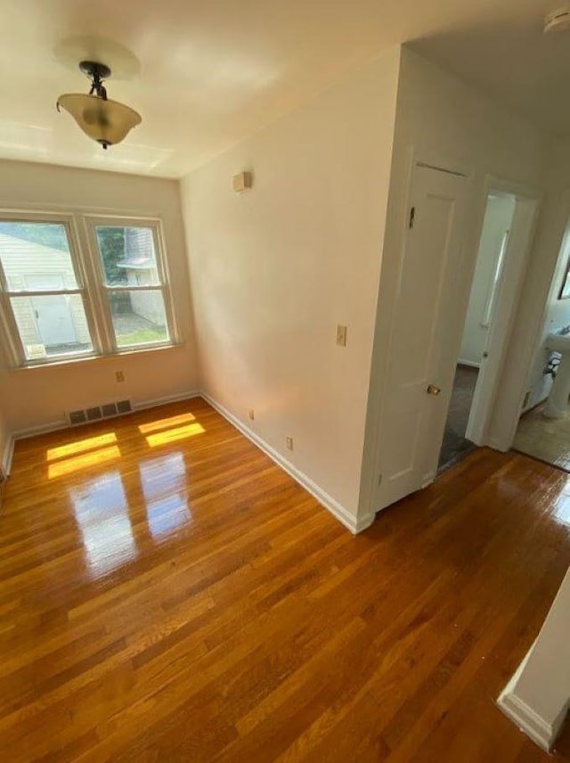 spare room featuring hardwood / wood-style floors