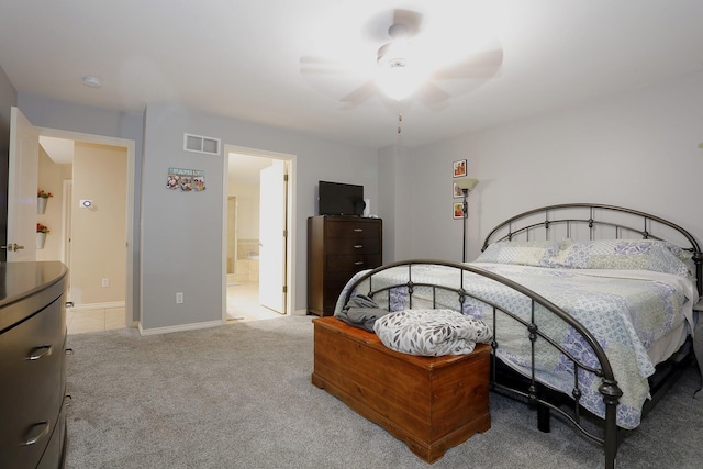 807 War Bonnet Dr, Tecumseh, MI 49286 - carpeted bedroom with baseboards, visible vents, ensuite bathroom, and a ceiling fan