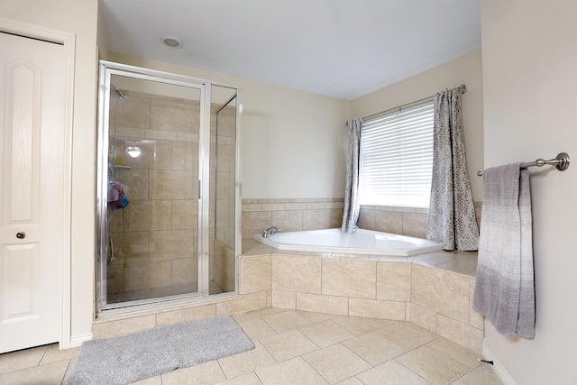 807 War Bonnet Dr, Tecumseh, MI 49286 - bathroom with a garden tub, tile patterned floors, and a stall shower