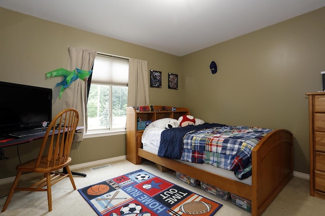 807 War Bonnet Dr, Tecumseh, MI 49286 - bedroom featuring baseboards, visible vents, and carpet flooring