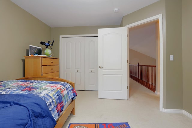 807 War Bonnet Dr, Tecumseh, MI 49286 - bedroom featuring a closet, baseboards, and light colored carpet
