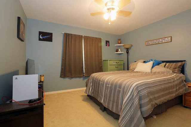 807 War Bonnet Dr, Tecumseh, MI 49286 - bedroom featuring baseboards, a ceiling fan, and light colored carpet