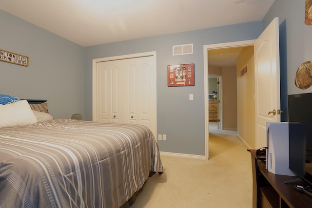 807 War Bonnet Dr, Tecumseh, MI 49286 - bedroom featuring a closet, baseboards, visible vents, and light colored carpet