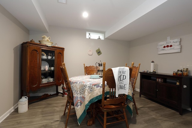 807 War Bonnet Dr, Tecumseh, MI 49286 - dining area with baseboards and wood finished floors