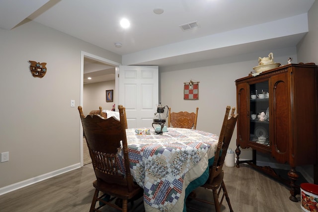 807 War Bonnet Dr, Tecumseh, MI 49286 - dining space with baseboards, visible vents, recessed lighting, and wood finished floors