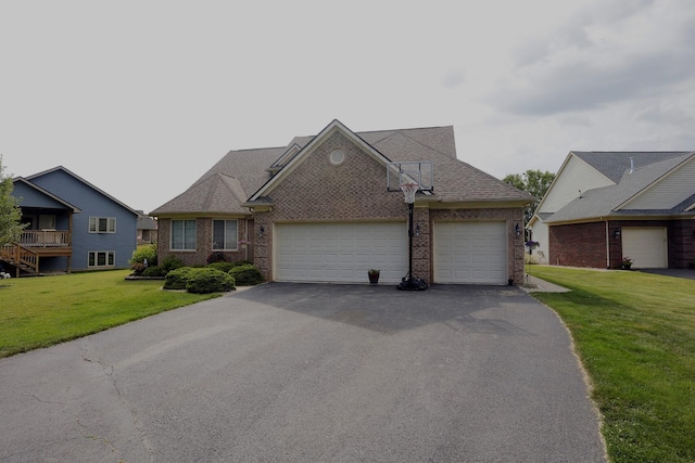 807 War Bonnet Dr, Tecumseh, MI 49286 - view of front facade featuring roof with shingles, an attached garage, driveway, a front lawn, and brick siding