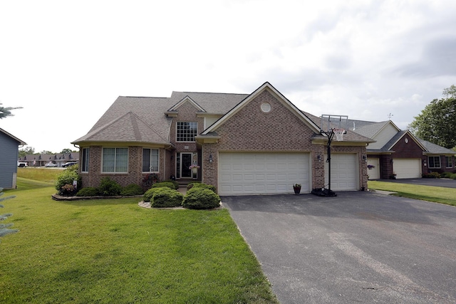807 War Bonnet Dr, Tecumseh, MI 49286 - view of front of property featuring brick siding, a front yard, driveway, and an attached garage
