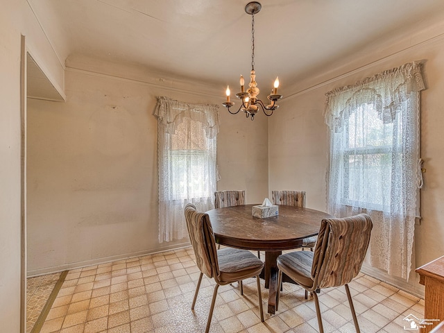 dining area featuring plenty of natural light and a chandelier