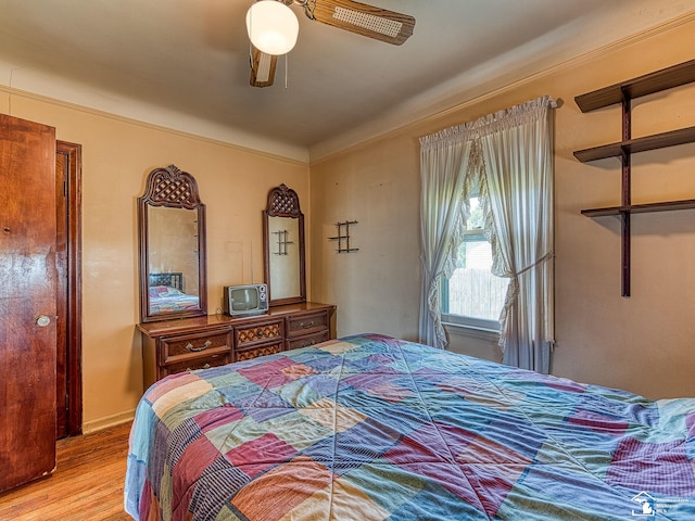 bedroom featuring ceiling fan and wood-type flooring