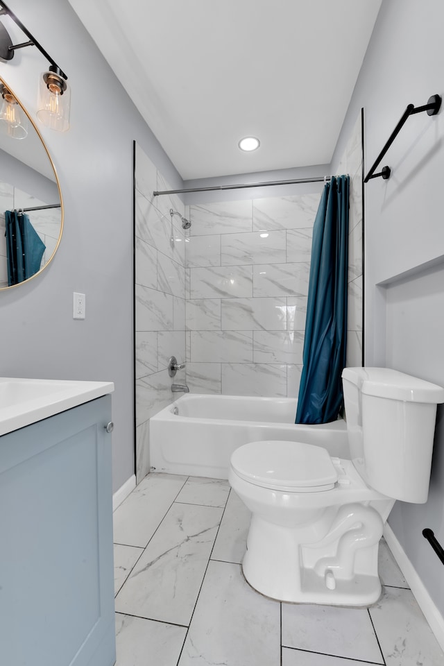 full bathroom with vanity, toilet, and shower / bath combo with shower curtain