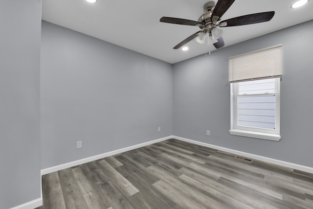 empty room with light hardwood / wood-style flooring and ceiling fan