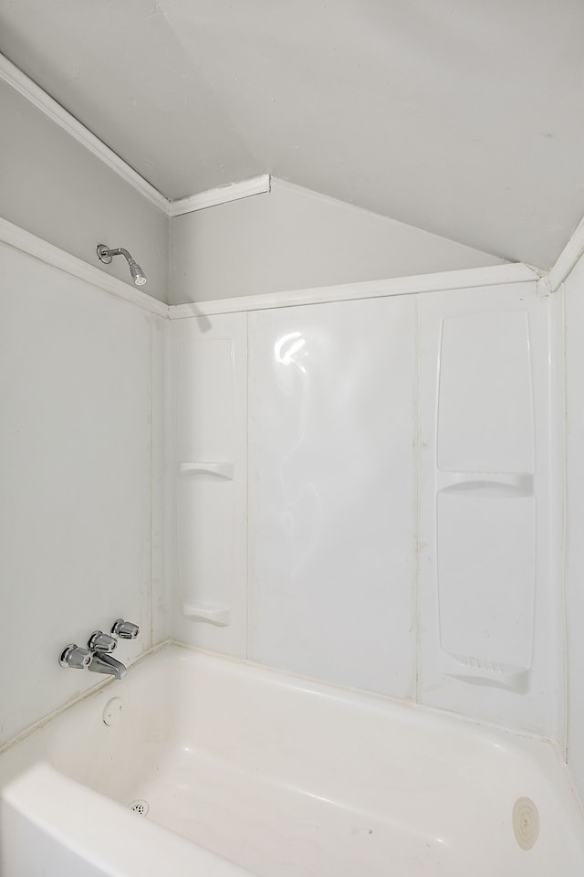 bathroom with  shower combination and vaulted ceiling