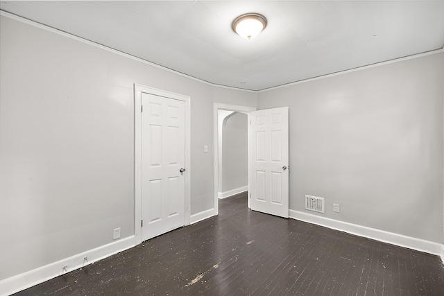 empty room with dark wood-type flooring