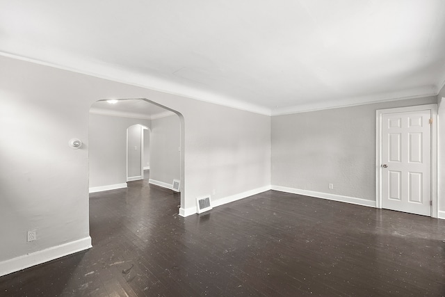 unfurnished room with dark hardwood / wood-style floors and ornamental molding