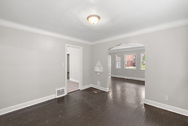 unfurnished room featuring crown molding and dark hardwood / wood-style floors