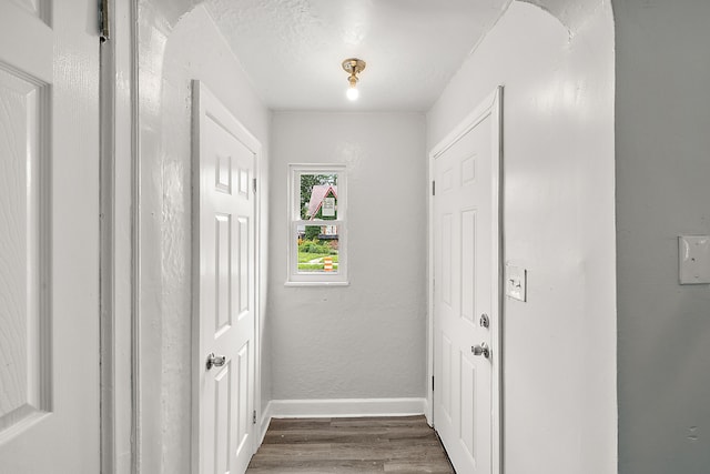 hall with dark hardwood / wood-style floors