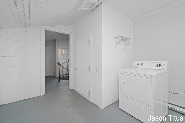 clothes washing area featuring washer / dryer and wood ceiling