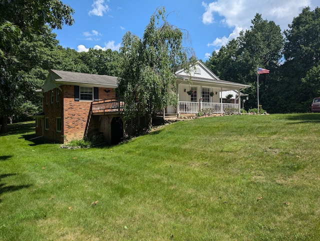 3641 Green Lake Rd, West Bloomfield, MI 48324 - back of house with brick siding, a lawn, and a porch