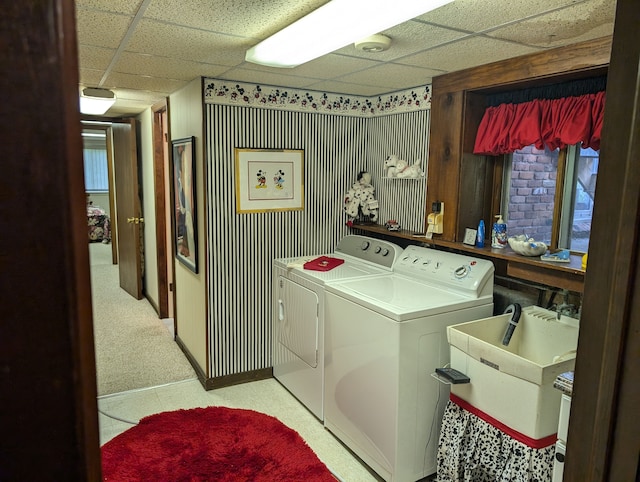 washroom featuring sink, light colored carpet, and washing machine and clothes dryer