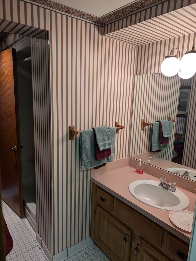 bathroom with tile patterned floors and vanity