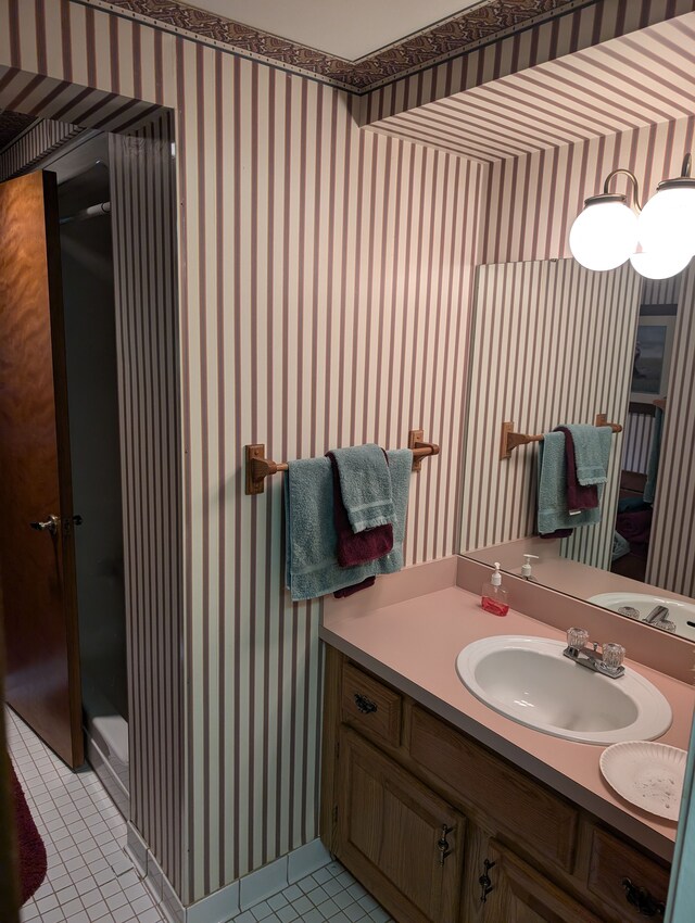 3641 Green Lake Rd, West Bloomfield, MI 48324 - bathroom featuring wallpapered walls, tile patterned flooring, and vanity