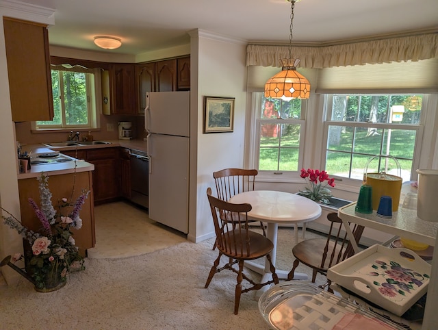 dining area with a wealth of natural light and sink