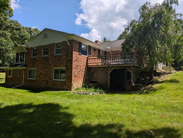 3641 Green Lake Rd, West Bloomfield, MI 48324 - back of property with brick siding, a wooden deck, a lawn, and a chimney