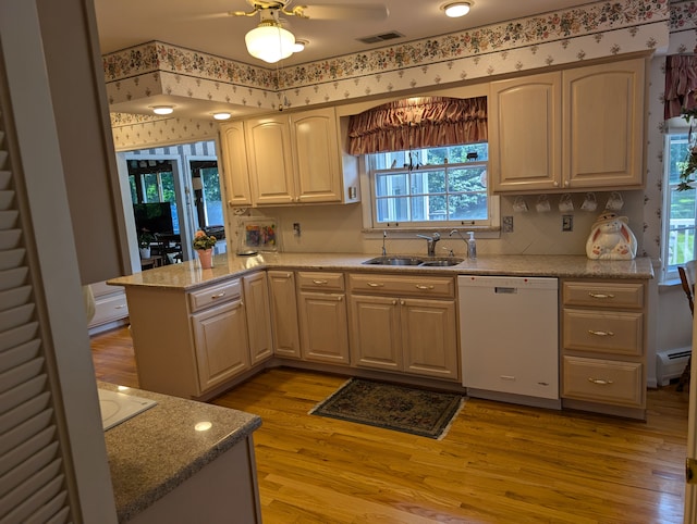 kitchen featuring kitchen peninsula, baseboard heating, sink, light hardwood / wood-style flooring, and dishwasher