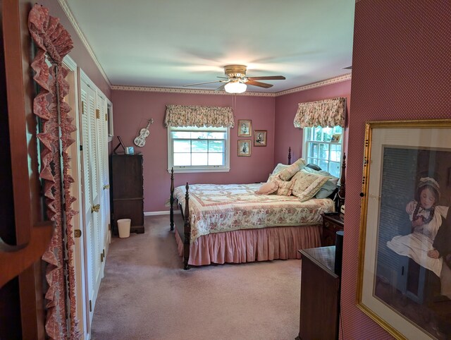 3641 Green Lake Rd, West Bloomfield, MI 48324 - carpeted bedroom with multiple windows, crown molding, a ceiling fan, and baseboards