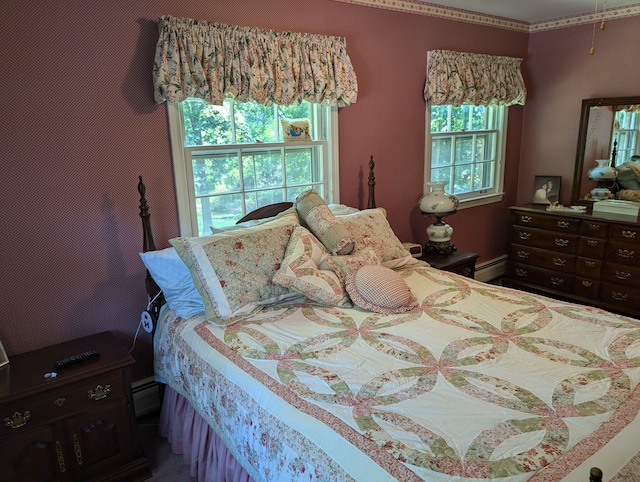 bedroom with a baseboard heating unit