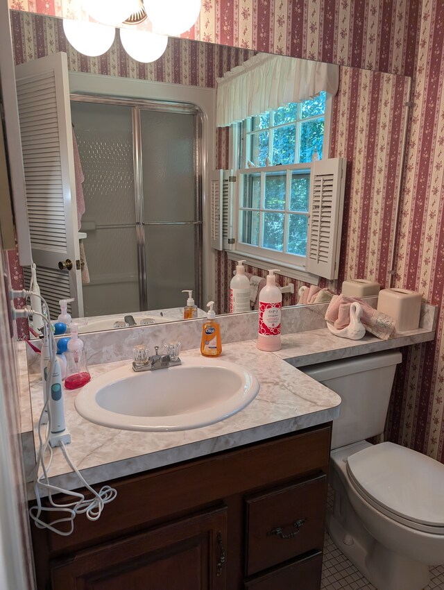 3641 Green Lake Rd, West Bloomfield, MI 48324 - full bathroom with wallpapered walls, vanity, a shower with door, and toilet
